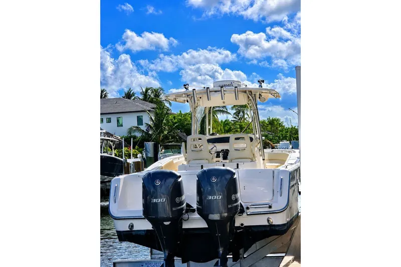 Slide: The Image of 2014 Grady-White Canyon 306 boat docked with twin Yamaha engines. - 27