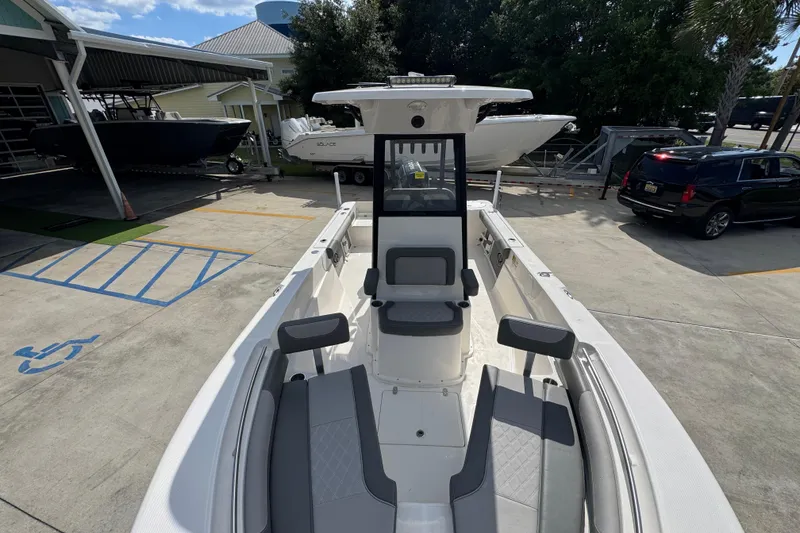 Slide: The Image of 2027 Sea Born LX22 Center Console boat in a marina setting. - 20