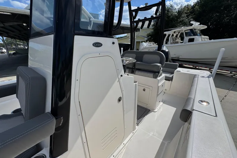 Slide: The Image of 2027 Sea Born LX22 Center Console boat interior with seating and console details. - 22