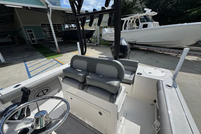 Slide: The Image of 2027 Sea Born LX22 Center Console boat interior with steering wheel and seating. - 24