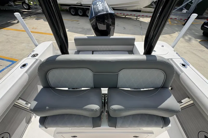 Slide: The Image of 2027 Sea Born LX22 Center Console boat interior with cushioned seating and sleek design. - 25