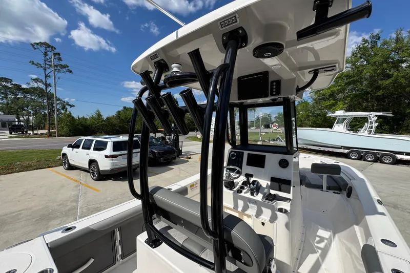 Slide: The Image of 2027 Sea Born LX22 Center Console boat with modern helm and rod holders. - 30