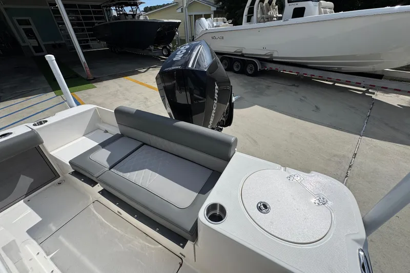 Slide: The Image of 2027 Sea Born LX22 Center Console boat with Mercury engine, featuring sleek seating and storage. - 31