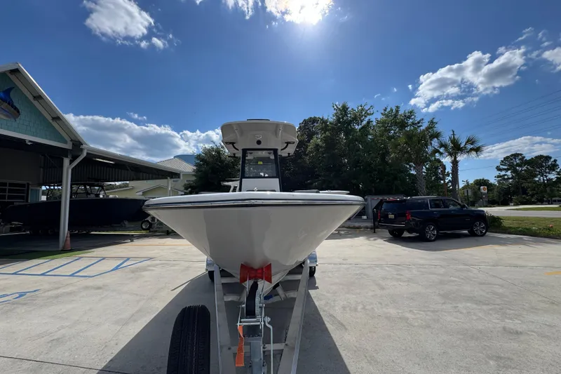 Slide: The Image of 2027 Sea Born LX22 Center Console boat on trailer under sunny sky. - 5