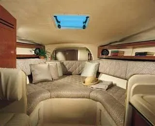 Slide: The Image of Interior of a 2002 Sea Ray Sundancer 280 yacht with cozy seating area. - 10
