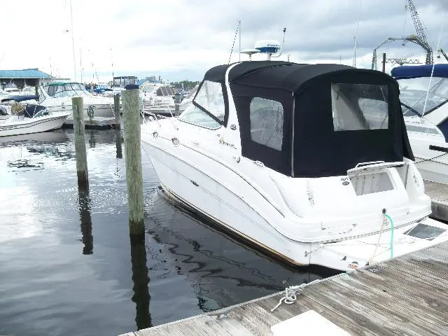Slide: The Image of 2002 Sea Ray Sundancer 280 docked with black canopy. - 2