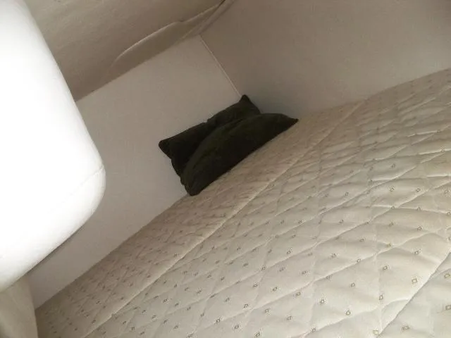 Slide: The Image of Interior of 2002 Sea Ray Sundancer 280 with cushioned bed. - 7