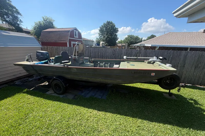 The Image of 2005 Southfork 1860 boat on trailer in backyard, sunny day. - 1