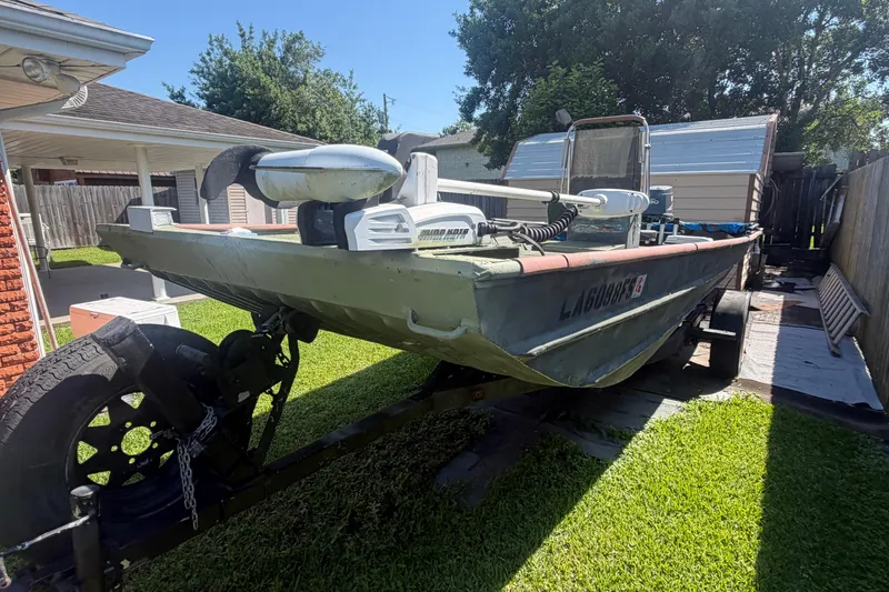 Slide: The Image of 2005 Southfork 1860 boat on trailer in residential backyard setting. - 10