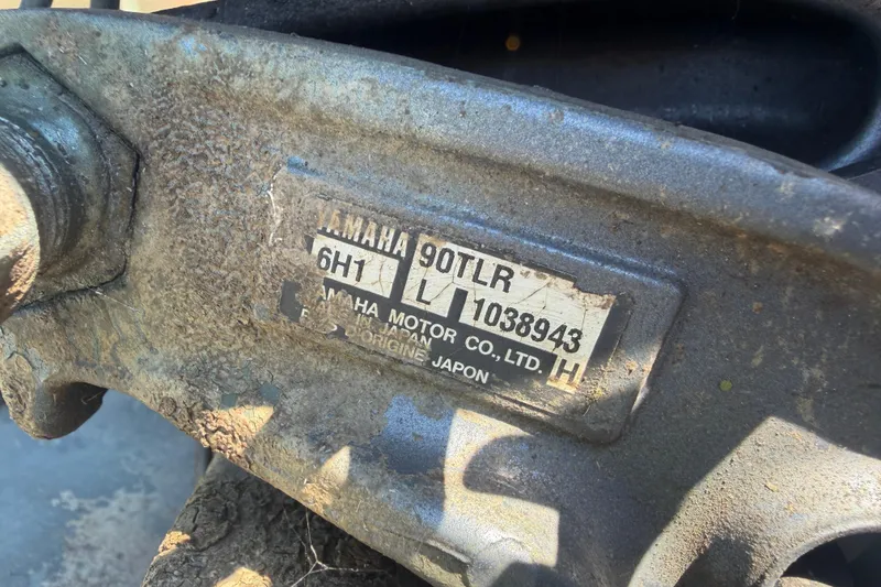 Slide: The Image of Close-up of a Yamaha 90TLR engine label on a 2005 Southfork 1860 boat. - 14