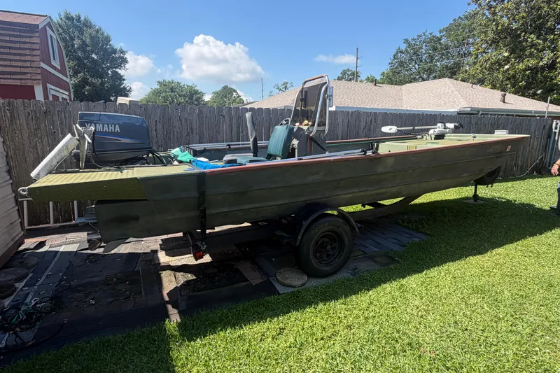 Slide: The Image of 2005 Southfork 1860 boat with Yamaha motor on trailer in backyard. - 9