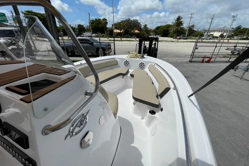 Slide: The Image of 2022 Tidewater 198 CC Adventure boat with spacious seating and modern design. - 11