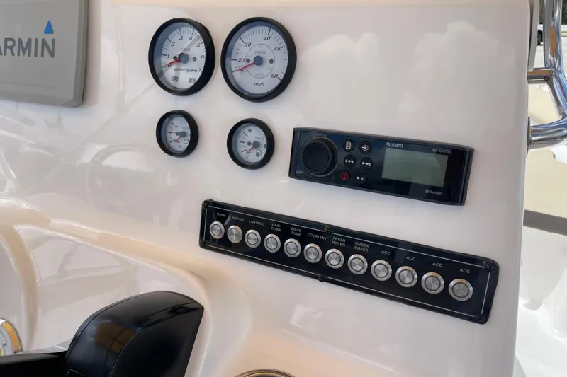 Slide: The Image of Dashboard of 2022 Tidewater 198 CC Adventure boat with gauges and controls. - 15