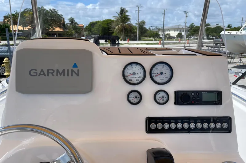 Slide: The Image of 2022 Tidewater 198 CC Adventure boat dashboard with Garmin navigation and gauges. - 17