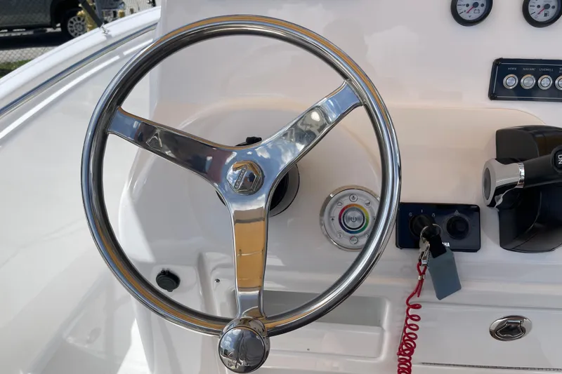 Slide: The Image of Steering wheel of 2022 Tidewater 198 CC Adventure boat with control panel. - 18
