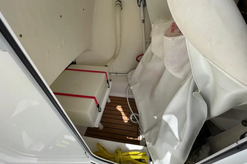 Slide: The Image of Interior view of 2022 Tidewater 198 CC Adventure boat storage compartment. - 19