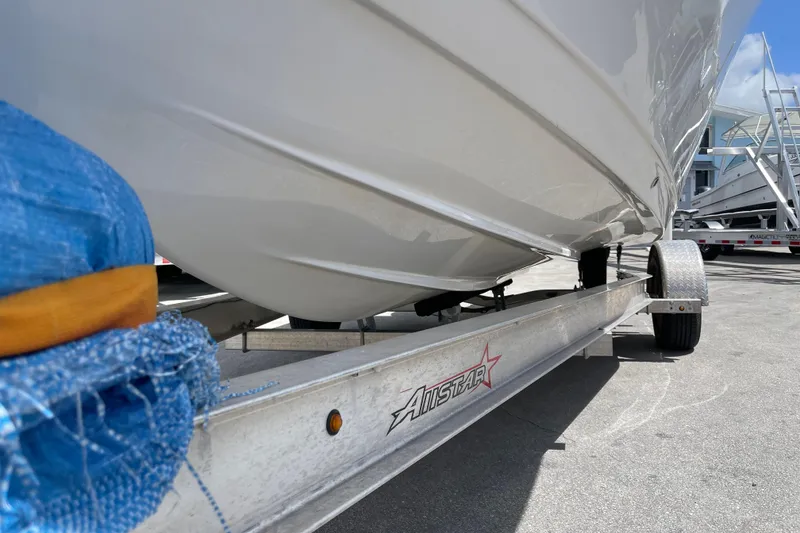Slide: The Image of 2022 Tidewater 198 CC Adventure boat on trailer, close-up view. - 6