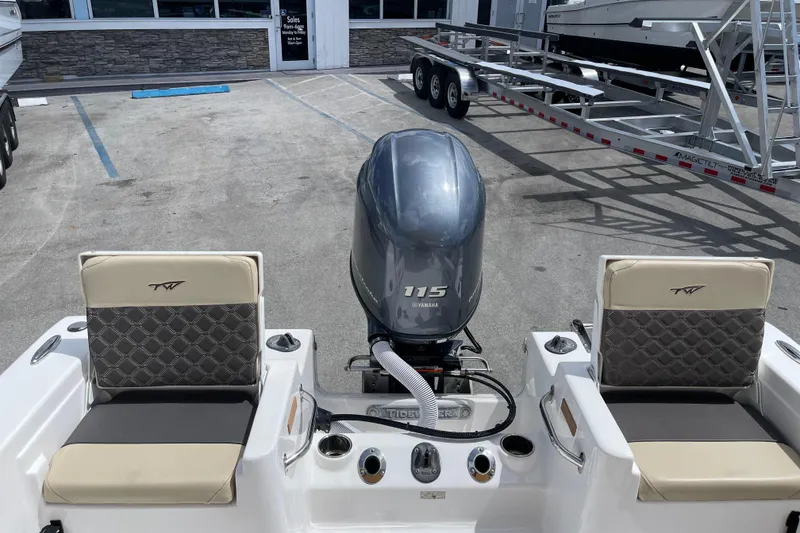 Slide: The Image of 2022 Tidewater 198 CC Adventure boat with Yamaha 115 engine, parked at dealership. - 8