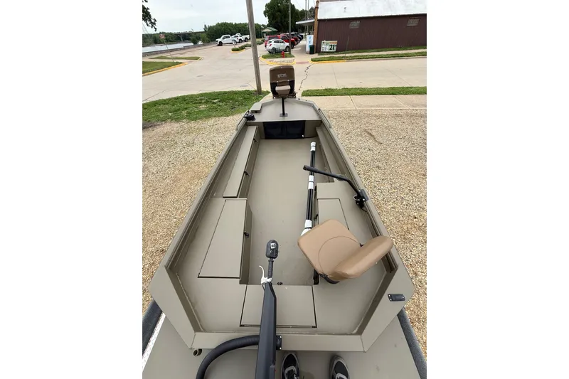 Slide: The Image of 2026 Excel 1860 Shallow Water F4 boat, beige interior, parked on gravel. - 10