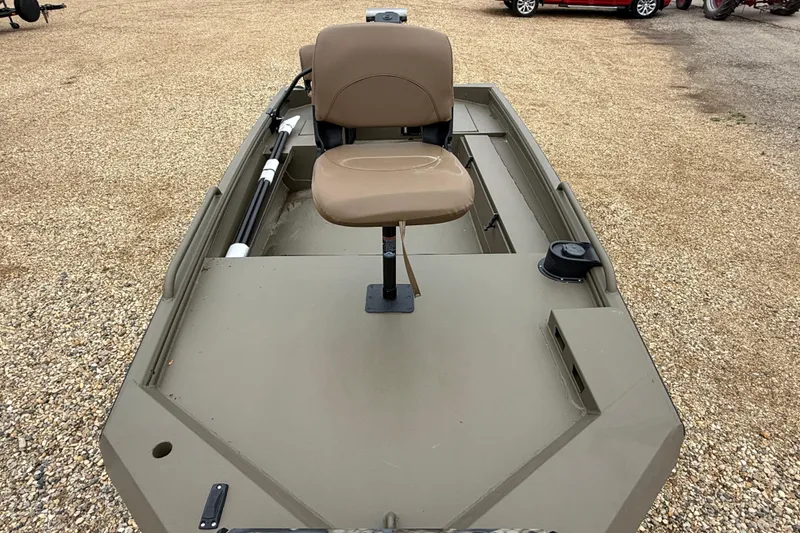 Slide: The Image of 2026 Excel 1860 Shallow Water F4 boat with tan seat on gravel surface. - 11