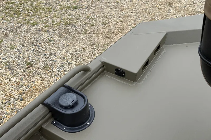 Slide: The Image of 2026 Excel 1860 Shallow Water F4 boat deck detail with fuel cap and rugged design. - 13