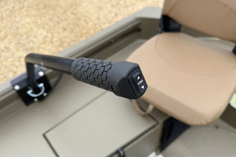 Slide: The Image of Close-up of Excel 1860 Shallow Water F4 boat's trim control handle, 2026 model. - 20