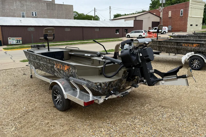 Slide: The Image of 2026 Excel 1860 Shallow Water F4 boat on trailer, parked outdoors. - 7