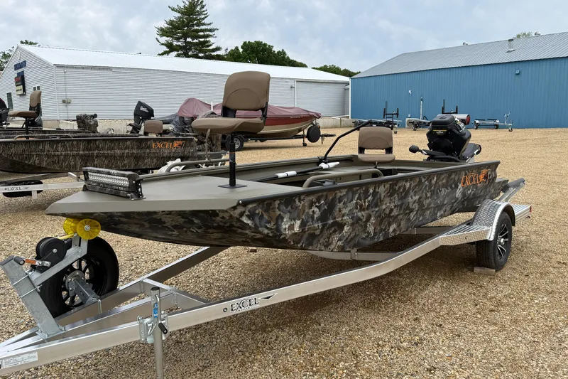 Slide: The Image of 2026 Excel 1860 Shallow Water F4 boat on trailer, camo design, outdoor setting. - 9