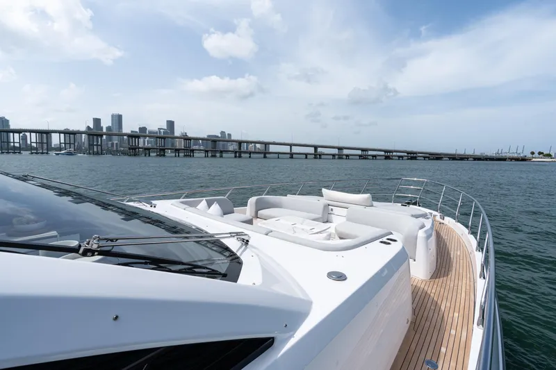 Slide: The Image of Luxurious 2022 Azimut 78 yacht cruising near city skyline and bridge. - 12
