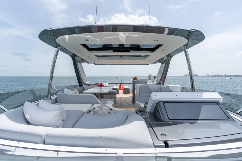Slide: The Image of Luxurious 2022 Azimut 78 yacht with spacious deck and elegant seating, overlooking serene ocean views. - 15