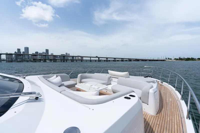 Slide: The Image of Luxurious 2022 Azimut 78 yacht with elegant deck seating, city skyline in background. - 21