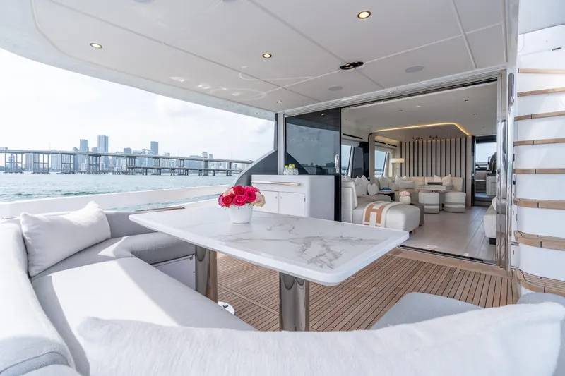Slide: The Image of Luxurious 2022 Azimut 78 yacht interior with elegant seating and scenic ocean view. - 23