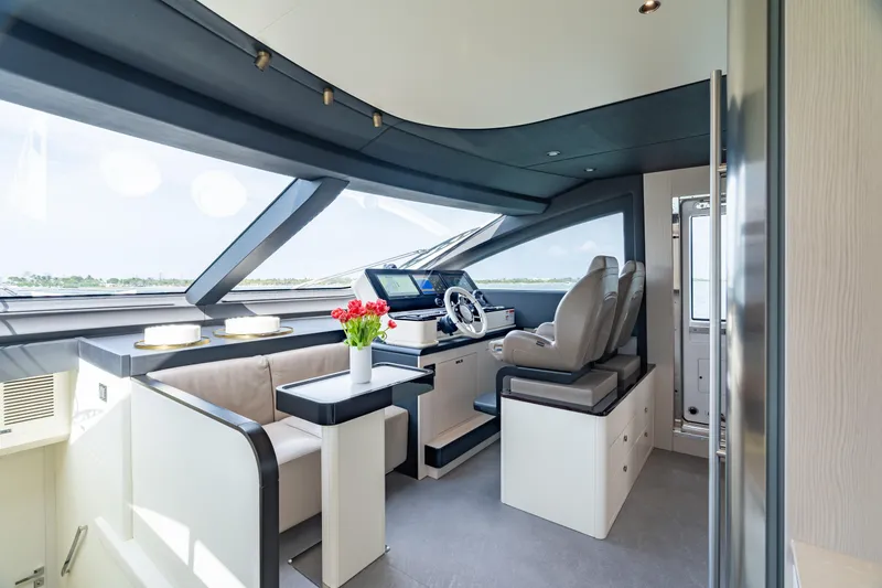 Slide: The Image of Luxurious interior of 2022 Azimut 78 yacht with modern helm and seating area. - 32