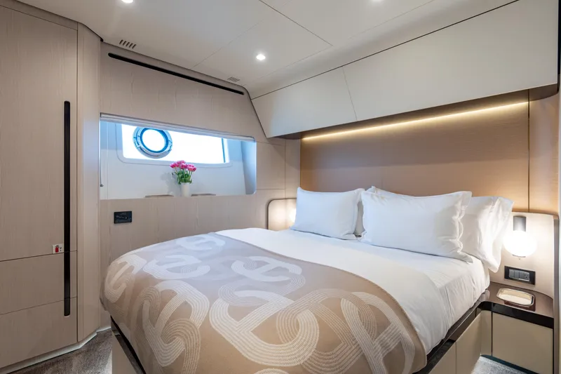Slide: The Image of Luxurious bedroom interior of 2022 Azimut 78 yacht with elegant bedding and modern lighting. - 34