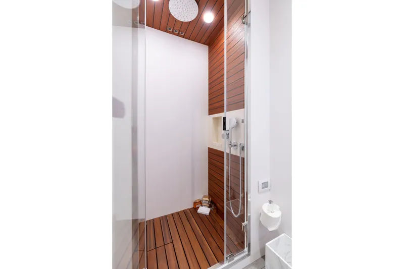 Slide: The Image of Luxurious shower in 2022 Azimut 78 yacht with wood paneling and modern fixtures. - 37