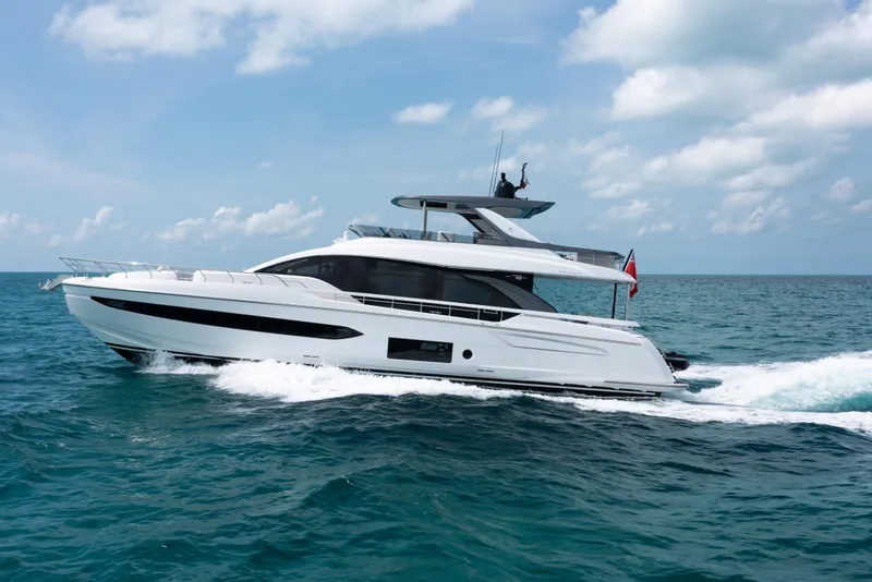 Slide: The Image of 2022 Azimut 78 yacht cruising on open sea under clear skies. - 4