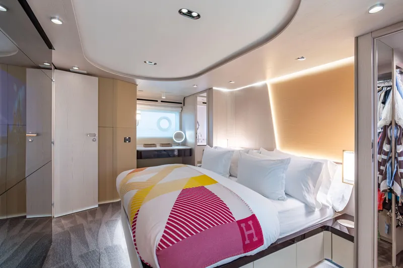 Slide: The Image of Luxurious bedroom interior of 2022 Azimut 78 yacht, featuring modern design and elegant lighting. - 41