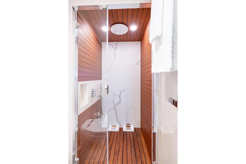 Slide: The Image of Luxurious shower in 2022 Azimut 78 yacht with wood paneling and modern fixtures. - 44