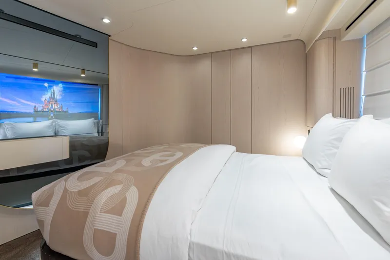 Slide: The Image of Luxurious bedroom interior of 2022 Azimut 78 yacht with elegant bedding and ambient lighting. - 49