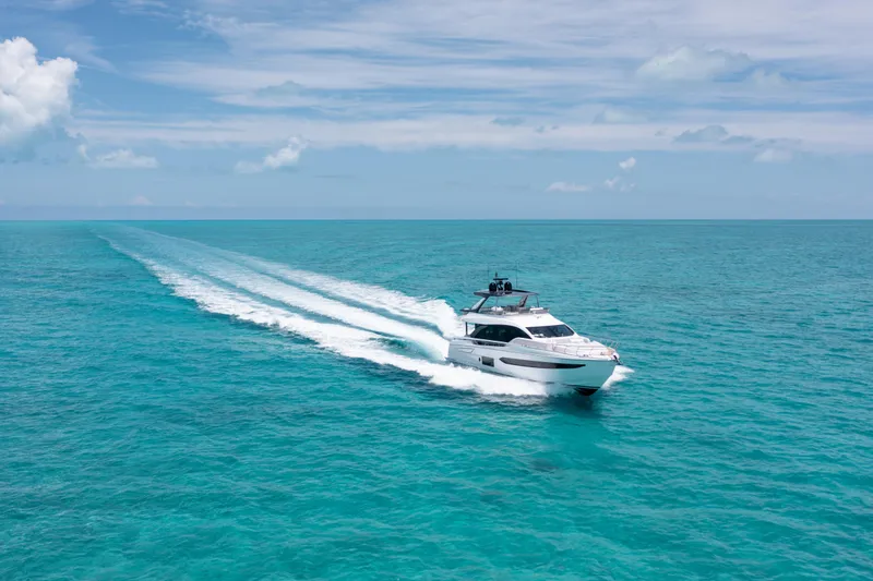 Slide: The Image of Azimut 78 yacht cruising on turquoise ocean, 2022 model, under clear blue sky. - 5