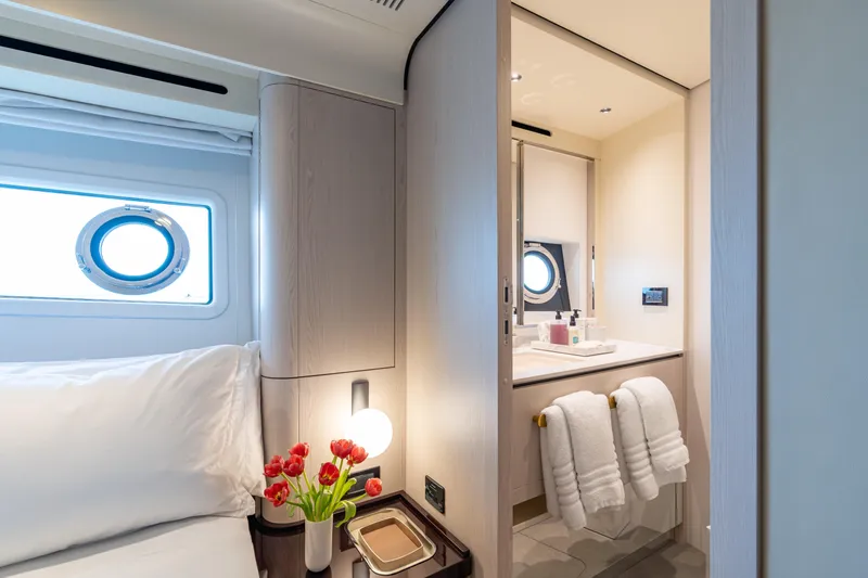 Slide: The Image of Luxurious interior of 2022 Azimut 78 yacht featuring elegant bedroom and bathroom design. - 50