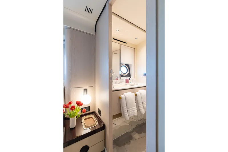 Slide: The Image of Luxurious bathroom interior of 2022 Azimut 78 yacht with modern decor and fresh flowers. - 51