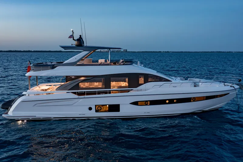 Slide: The Image of Luxurious 2022 Azimut 78 yacht cruising on serene ocean waters at dusk. - 9