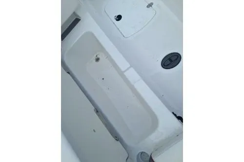 Slide: The Image of 2023 Tahoe T18 boat interior with storage compartments and seating area. - 11