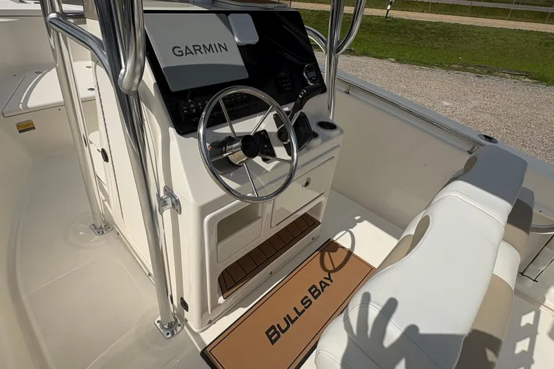 Slide: The Image of 2024 Bulls Bay 230 Center Console boat interior with Garmin navigation system. - 11