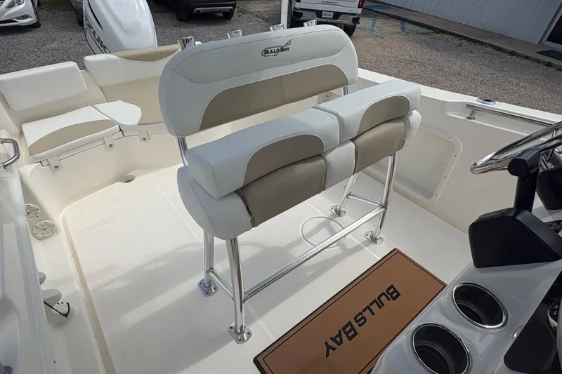 Slide: The Image of 2024 Bulls Bay 230 Center Console boat interior with seating and console details. - 13