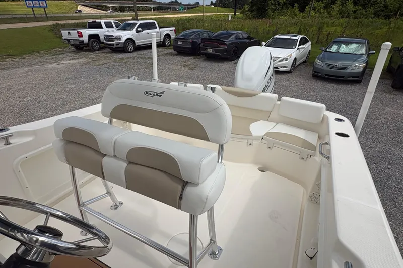 Slide: The Image of 2024 Bulls Bay 230 Center Console boat interior with seating and steering wheel. - 14