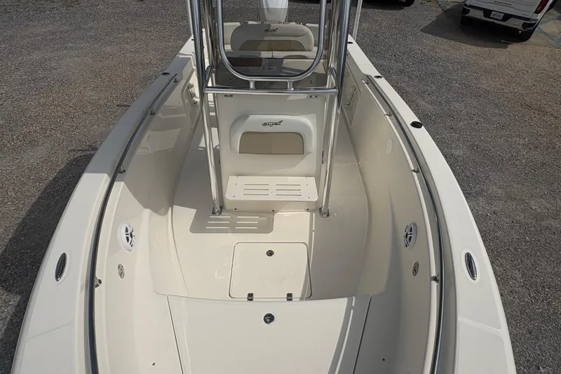 Slide: The Image of 2024 Bulls Bay 230 Center Console boat interior with seating and storage compartments. - 15