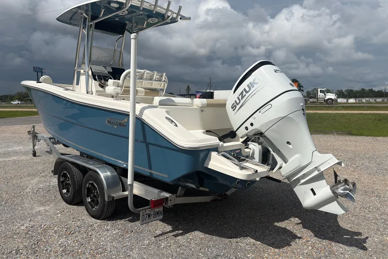 Slide: The Image of 2024 Bulls Bay 230 Center Console boat with Suzuki outboard motor on trailer. - 5