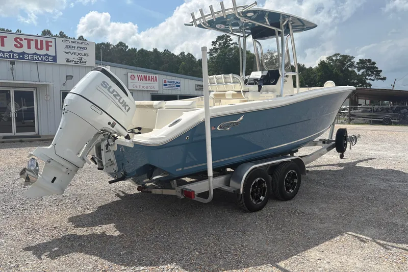 Slide: The Image of 2024 Bulls Bay 230 Center Console boat with Suzuki outboard motor on trailer. - 6